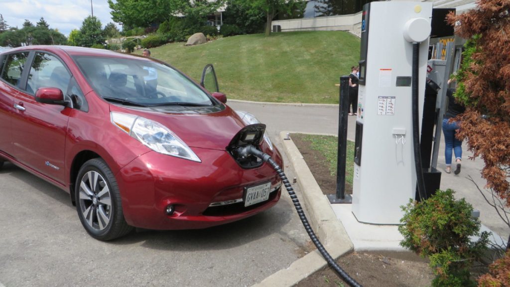 A Nissan Leaf gets a charge at a station similar to those which Ontario plans to install to encourage electric vehicle use in and between major communities.