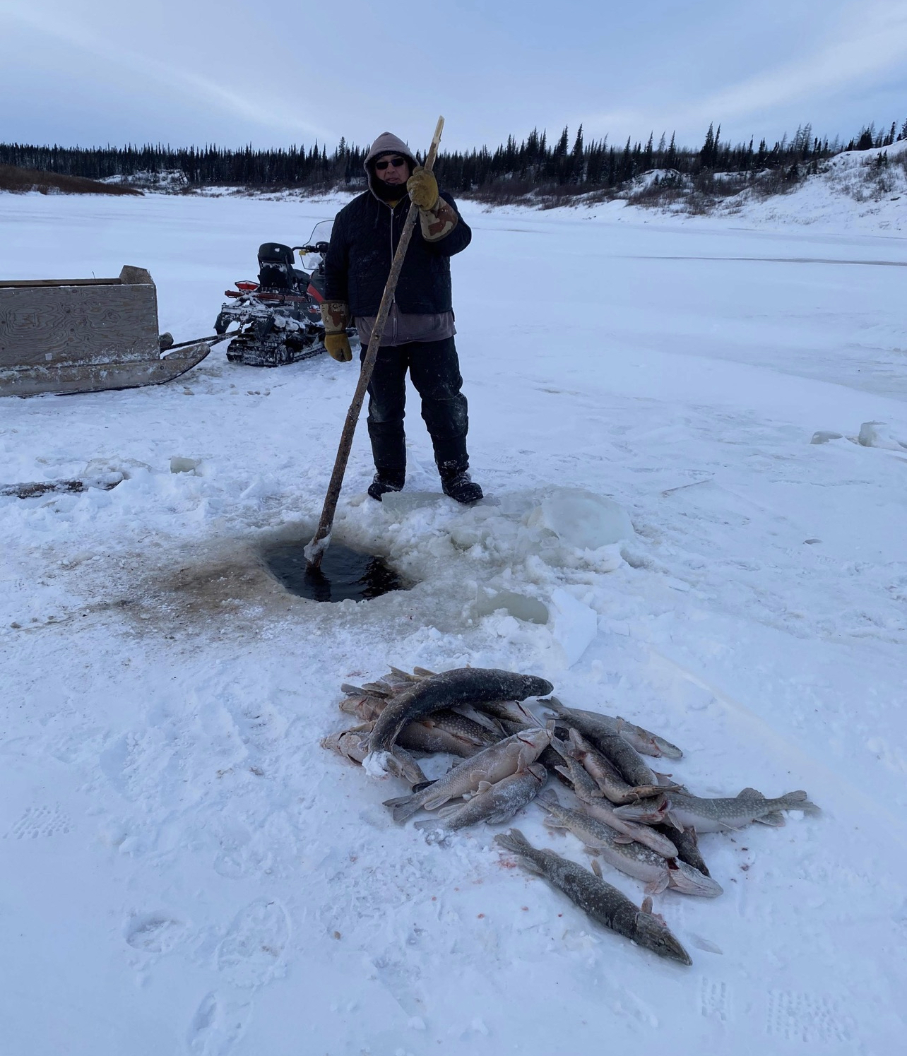 A Self-Determined Household Support Program participant fishing in Northern Ontario.