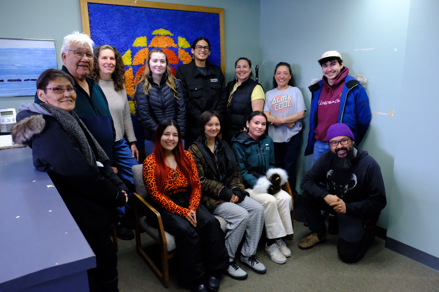 The spring 2023 cohort from NJTI's pilot Community Journalism Training Program hosted in Inuvik, NT toured the CBC North station with local radio host Wanda McLeod. L to R (standing): Agnes Pascal, Louie Goose, Laurie Sarkadi, Marie Carpenter, Felix Beaver, Julie Beaver, Wanda McLeod, K'a Nakehk'o. L to R (sitting/kneeling): Monica Loreen-Dillon, Teresa Procee, Tyanna Bain, Dëneze Nakehk'o.