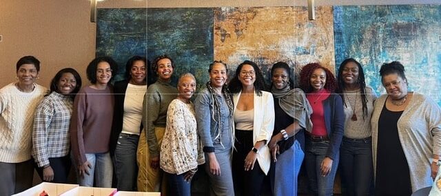 Members of the Black Canadian Fundraisers’ Collective (BCFC), standing in a line smiling at the camera. BCFC holds a Community Advised Fund at MakeWay